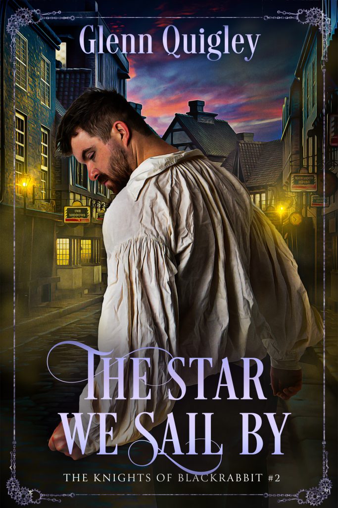 The cover to the novel THE STAR WE WAIL BY - THE KNIGHTS OF BLACKRABBIT BOOK TWO by Glenn Quigley. An unshaven young man in an 18th century shirt looks over his shoulder. In the background, a road lined with half-timbered buildings and street lamps.